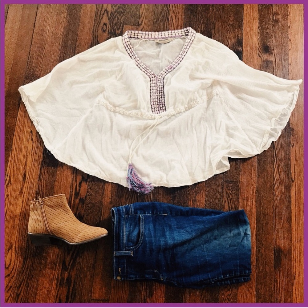 flowy poncho with tassels